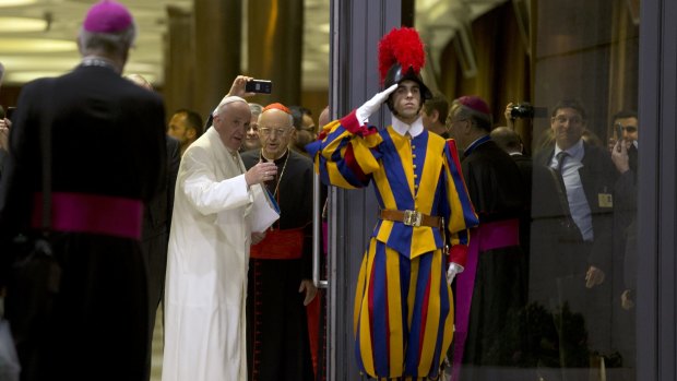 Pope Francis leaves at the end of the synod of bishops after calling for a more merciful and less judgmental Church.