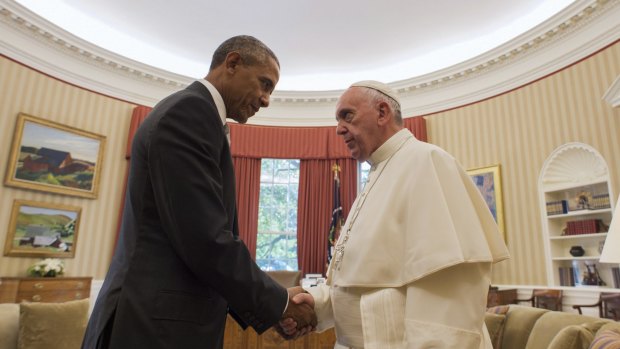 President Barack Obama shakes with Pope Francis in the Oval Office of the White House, in Washington. President Obama supports gay marriage.