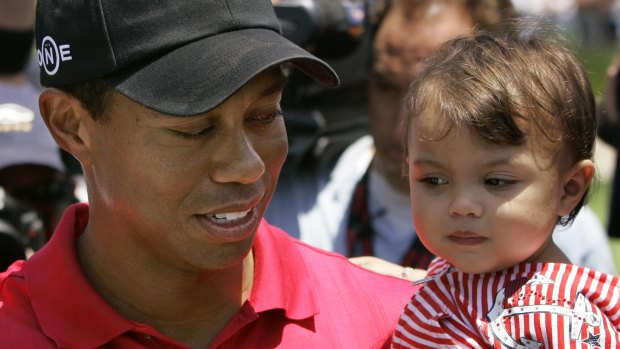 Tiger Woods holds his daughter, Sam Alexis, after winning the US Open championship in 2008.
