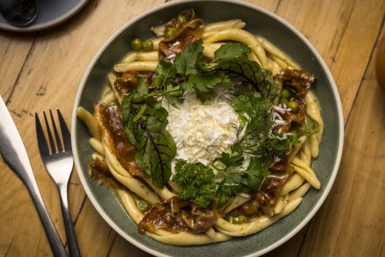 Small Axe's signature breakfast pasta: maccaruni with guanciale, peas, mint, salted ricotta and a slow-cooked egg.