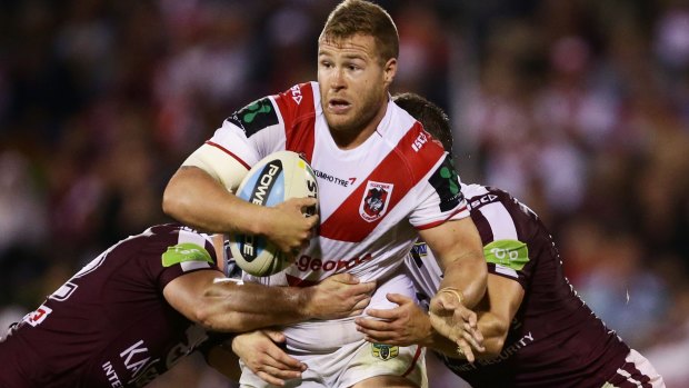 Staying put: Trent Merrin tries to breach the Manly defence at WIN Stadium on Saturday.