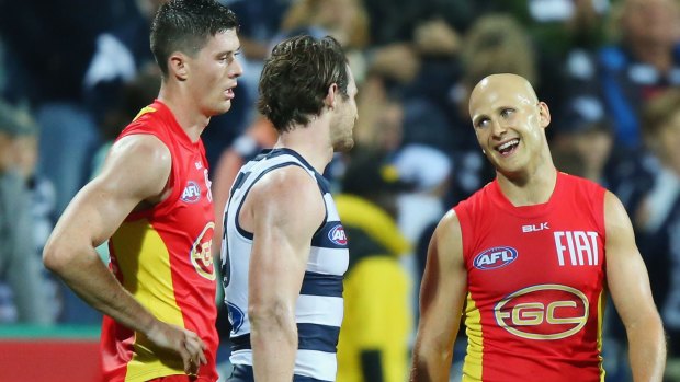 From one star to another: Gary Ablett of the Suns compares notes with Patrick Dangerfield of the Cats after the game.