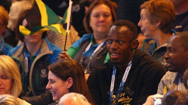 Usain Bolt cheers on his fellow Jamaicans in the netball.