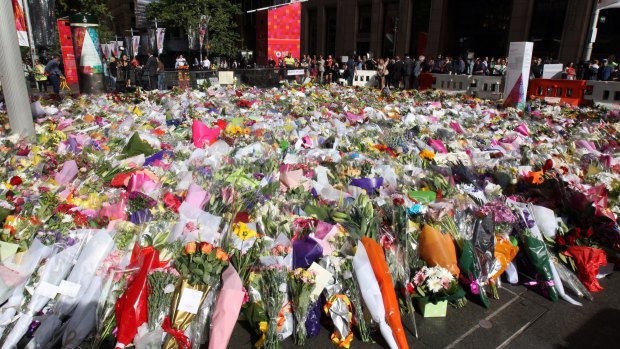 Tribute: The memorial to the victims of the Lindt cafe siege continued to grow in Martin Place on Wednesday.
