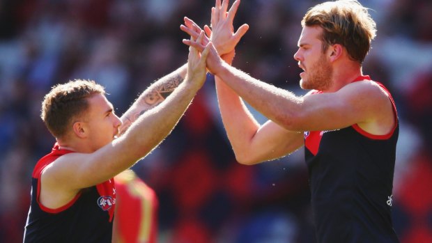 Demons Dean Kent and Jack Watts celebrate a goal during the win against Gold Coast on Sunday.