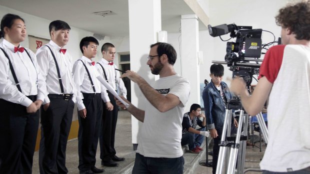 Sam Voutas directing a scene in China.