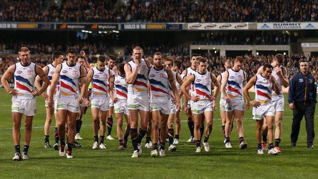 Emotional Crows players walk from field after their loss to the West Coast Eagles.