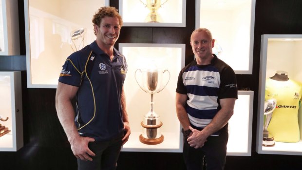 David Pocock and Sydney Convicts player Patrick Walsh pose with the Bingham Cup, the trophy for the World Cup of gay rugby, in 2013.
