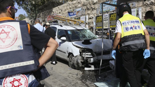 A Palestinian rammed a vehicle into a bus stop in Jerusalem before stabbing people, police said.