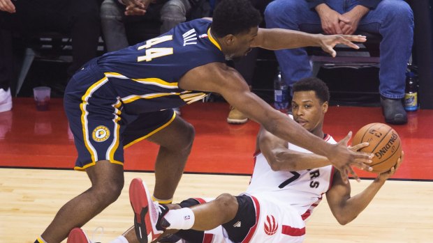 Keep away: Toronto Raptors guard Kyle Lowry battles for the ball against Indiana Pacers forward Solomon Hill.