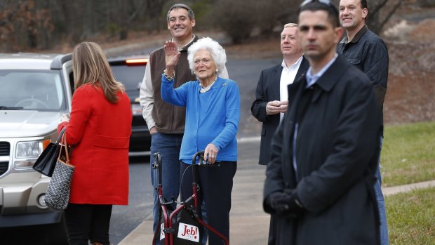 Barbara Bush waves goodbye to her son outside a polling place in Greenville, South Carolina. Her return to the campaign trail exposed her and her son to ridicule.