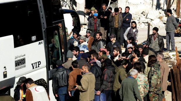 Syrian opposition fighters prepare to evacuate Zabadani town, Syria, on Monday.