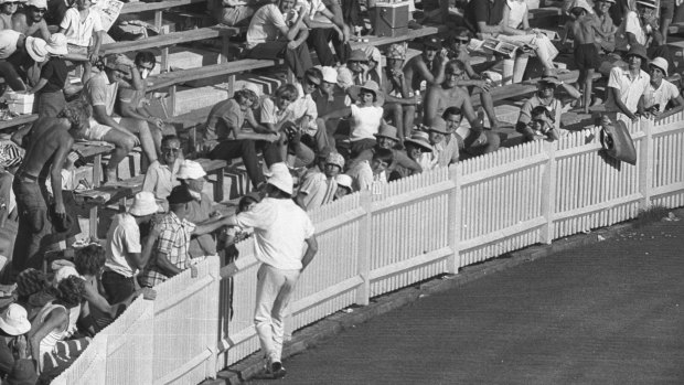 Englishman John Snow has an altercation with a spectator along the boundary fence at the SCG during an Ashes Test in 1971.