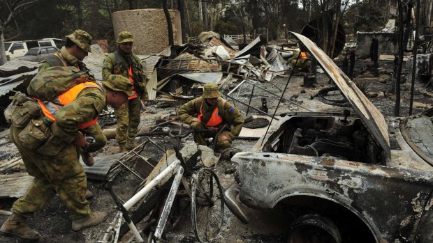 Army crews search for bodies in homes burnt during the 2009 Black Saturday bushfires.