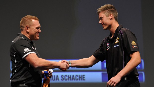 Then Brisbane coach Justin Leppitsch welcomes Josh Schache to the club at the 2015 AFL draft.
