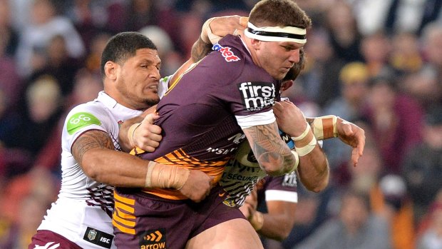 No stopping him: Josh McGuire of the Broncos attempts to break through the Manly defence.