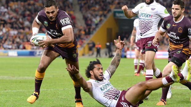 That'll do: Justin Hodges of the Broncos breaks away from the defence to score for Brisbane. 