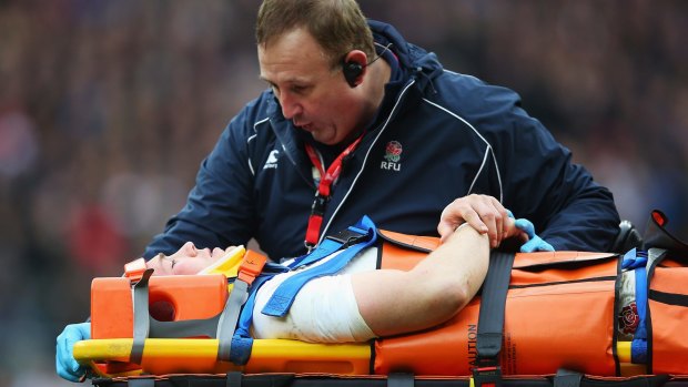 Serious knock:  Mike Brown of England is stretchered off.
