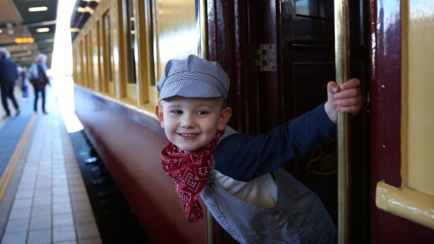 Three-year-old train enthusiast Lincoln Murphy-Rogers enjoys the ambience of old-era trains on display during a heritage event at Sydney's Central Station.