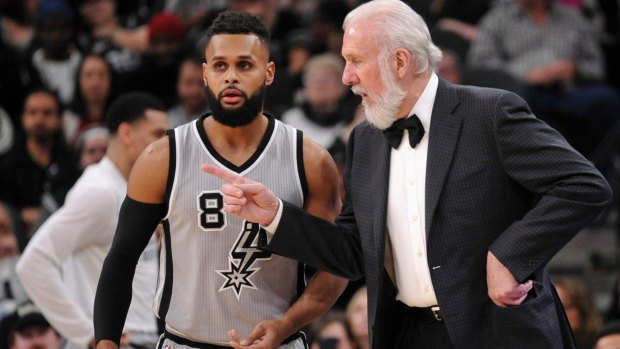 San Antonio Spurs head coach Gregg Popovich, right, talks to Spurs guard Patty Mills, of Australia, during the second half of an NBA basketball game against the Dallas Mavericks, Sunday, Jan. 29, 2017, in San Antonio. Dallas won 105-101. (AP Photo/Darren Abate) Patty Mills and Gregg Popovich NBA San Antonio Spurs.