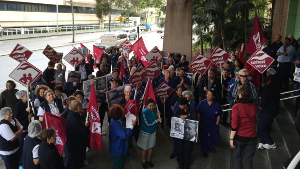 Hospital workers make their feelings felt outside Royal Perth Hospital.