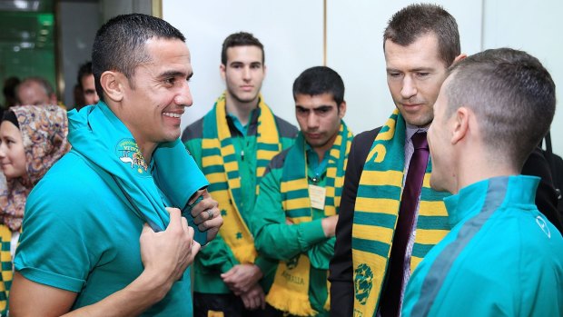 Wake-up call: Socceroos Tim Cahill and Matt McKay chat with former Socceroo Brett Emerton at Parliament House on Monday.