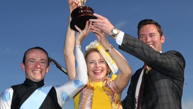 Winning combination: Stephen Baster, Gai Waterhouse and Adrian Bott hold the Victoria Oaks cup after Pinot won the group 1 race on Oaks Day.