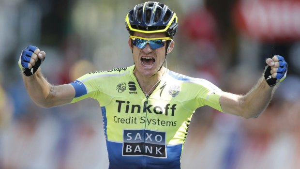 Michael Rogers celebrates as he crosses the finish line to win the  16th stage of the 2014 Tour de France.