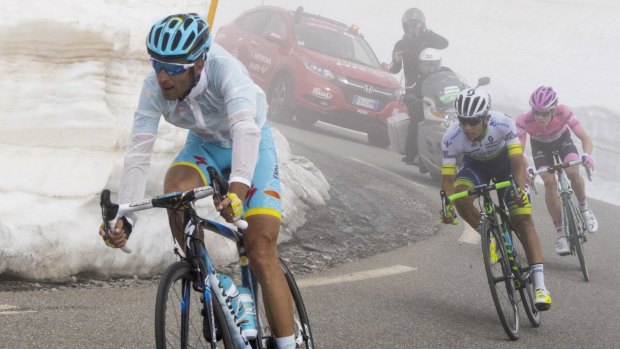 Italian rider Vincenzo Nibali of Astana Pro Team, Colombia's Vincenzo Nibali of Orica GreenEdge and Dutch rider Steven Kruijswijk of Team Lotto Jumbo pedal during the 19th stage.