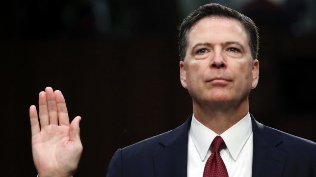Former FBI director James Comey is sworn in during the Senate hearing.