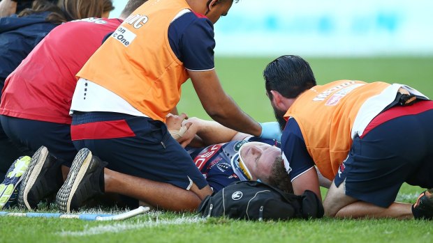 Accidental elbow: Reece Hodge is treated on the field.