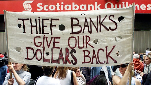 Argentinians protest against the suspension of their bank in Buenos Aires during the 2001 default.