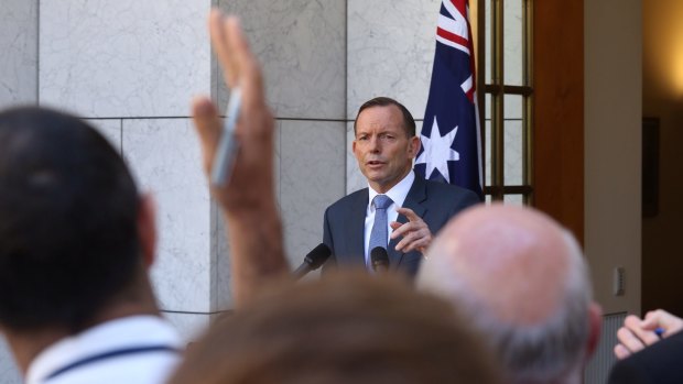 Prime Minister Tony Abbott takes questions during a press conference in Canberra on Monday.