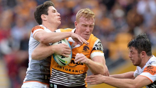 Jack Reed of the Broncos takes on the defence during the round 19 match against the Wests Tigers at Suncorp Stadium.