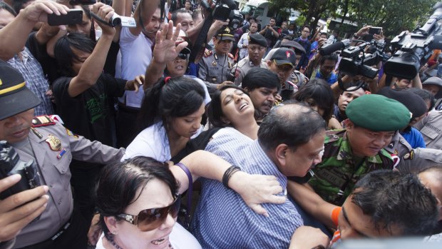 Myuran Sukumaran's sister, Brintha, is overcome on her way to Nusakambangan island.