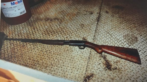 The .22 calibre Browning pump action rifle in the rear tray area of a white Nissan Patrol Turbo diesel utility.