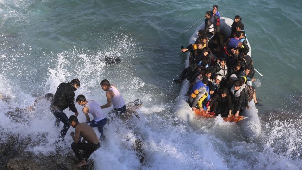 Refugees and migrants abort their departure by dinghy from the Turkish coast to the Greek island of Chios, near Cesme, Turkey on Saturday due to rough seas.