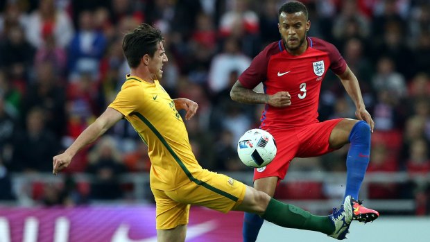 One to watch: Australia's Milos Degenek vies for the ball with England's Ryan Bertrand.