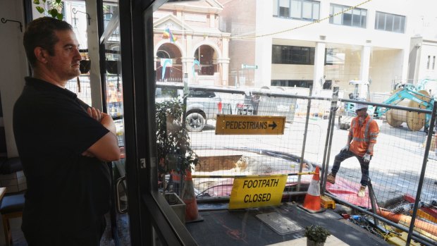 Emanuel Tzirtzilakis says there is no end in sight to  construction outside his Surry Hills cafe.