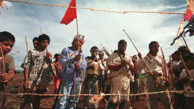 Guarani-Kaiowa people at the gate on their land on the Dourados reservation in 1998.