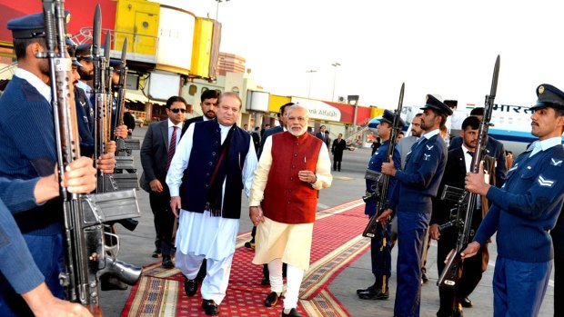 Indian Prime Minister Narendra Modi, right, reviews a guard of honour with his Pakistani counterpart, Nawaz Sharif, in Lahore on Friday.