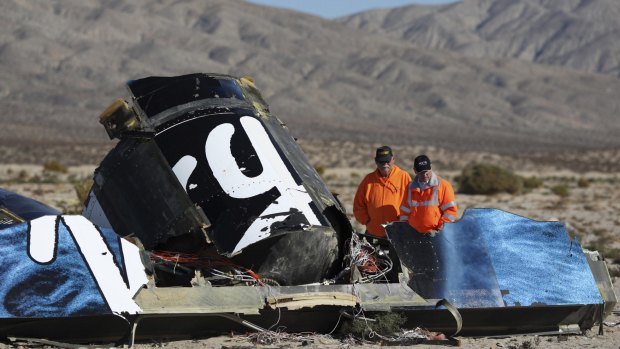 Police look at wreckage at the Virgin Galactic SpaceShipTwo crash site near Cantil, California on November 2.