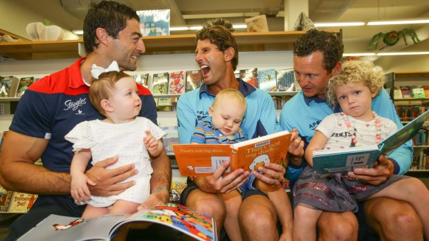 Former Sydney Roosters captain Anthony Minichiello with daughter Azura Tresor, 14 months (left); Waverley Council lifeguards Anthony "Harries" Carroll with son Billy Carroll, 14 months, and Dean "Deano" Gladstone with daughter Lucy Gladstone, three. They are the official ambassadors of the Waverley Library initiative. 