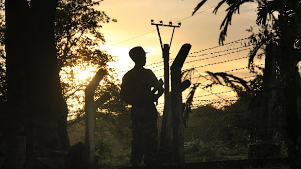 A border patrol guard at a police post in Kyee Kan Pyin, Buthidaung, Rakhine state Myanmar.