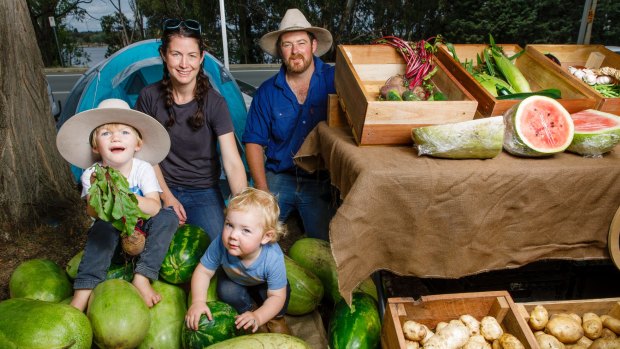 Erin Cooper and Dan Mundy from Tobellie Hill Produce in Kindervale with their children Toby, 3, and Ellie, 2. 