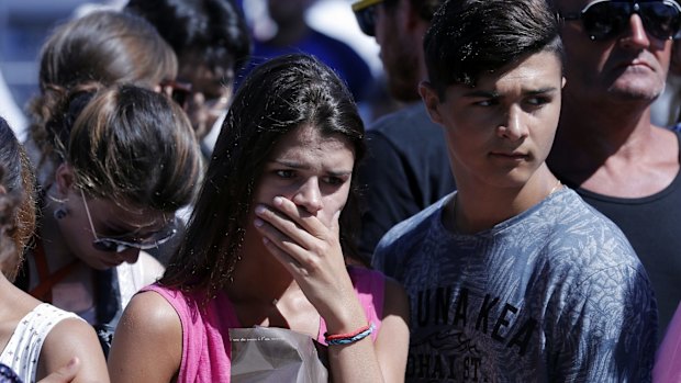 A woman visiting the scene of Thursday's carnage.