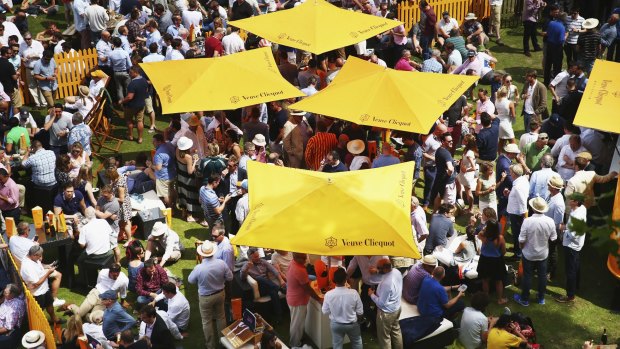   Fans enjoy the carnival atmosphere of the Veuve Clicquot garden  at Lord's. 