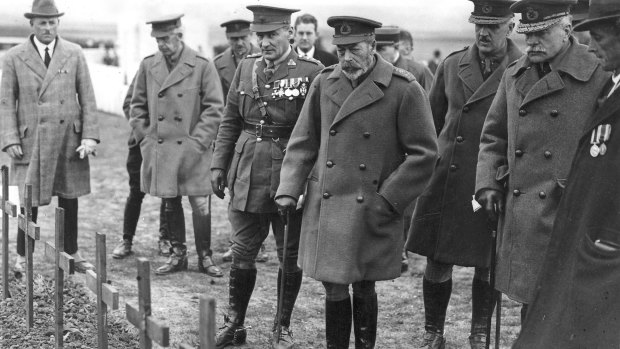 King George V entering Crouy Cemetery, France with Fabian Ware behind him to his right. 