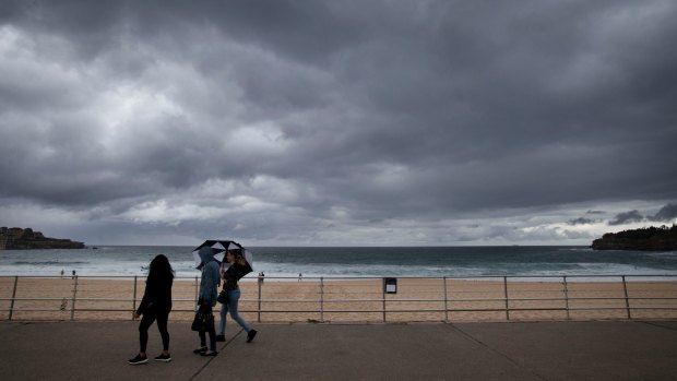 Storm clouds loom over Bondi Beach at the start of an unusually cool weekend.