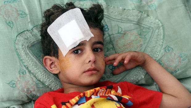A boy wounded in one of Friday's suicide attacks recovers in a Sanaa hospital.